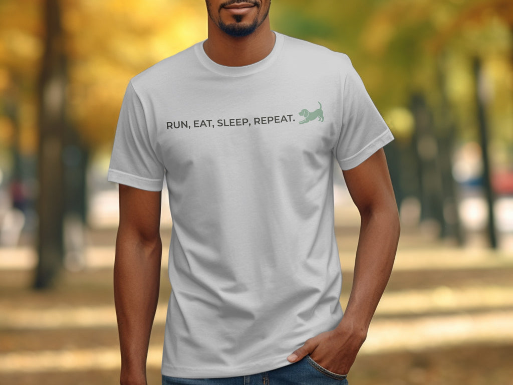 Man wearing a white t-shirt with "RUN, EAT, SLEEP, REPEAT." text and a cat.