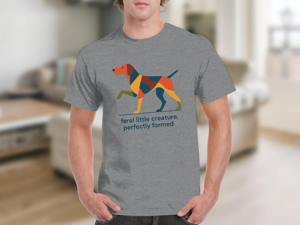 Grey t-shirt with a geometric dog illustration and text "feral little creature, perfectly formed".