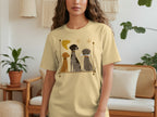 T-shirt with three illustrated dogs, two sitting and one with a bone.