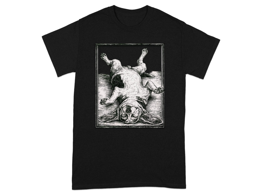 Black t-shirt with woodcut-style print of a dog lying on its back.