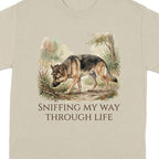 German Shepherd sniffing in a wooded area with text "Sniffing My Way Through Life".