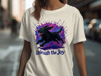 Black dog running with colorful splatters and text "Unleash the Joy".