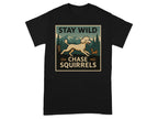 Black t-shirt with a graphic of a poodle chasing squirrels in a forest setting.