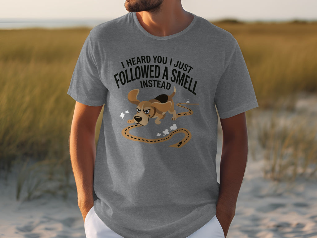 Grey t-shirt with cartoon dog and text "I HEARD YOU I JUST FOLLOWED A SMELL INSTEAD".