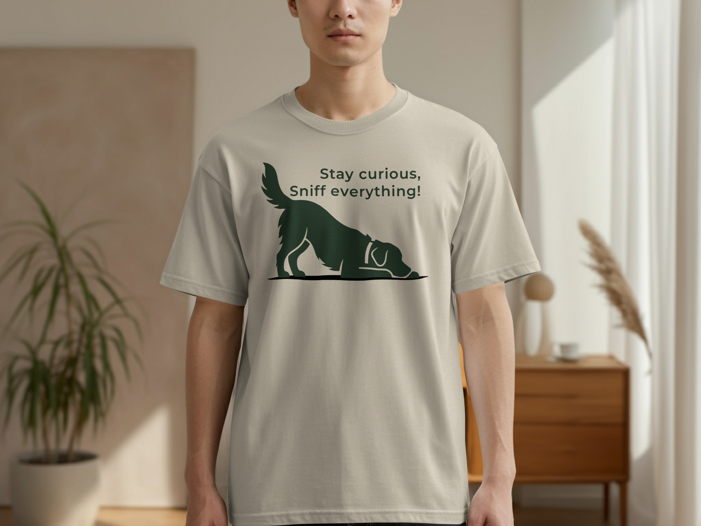 Light grey t-shirt with a silhouette of a dog sniffing the ground and text.