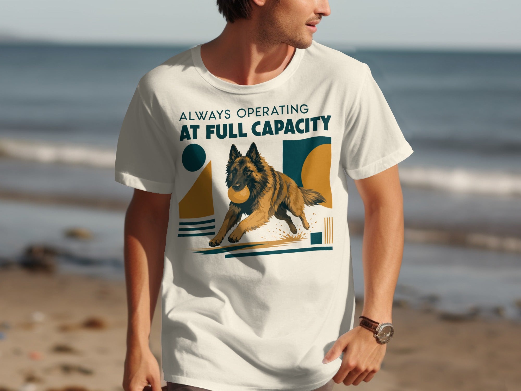 Man wearing a white t-shirt with a running dog and "Always Operating At Full Capacity" text.