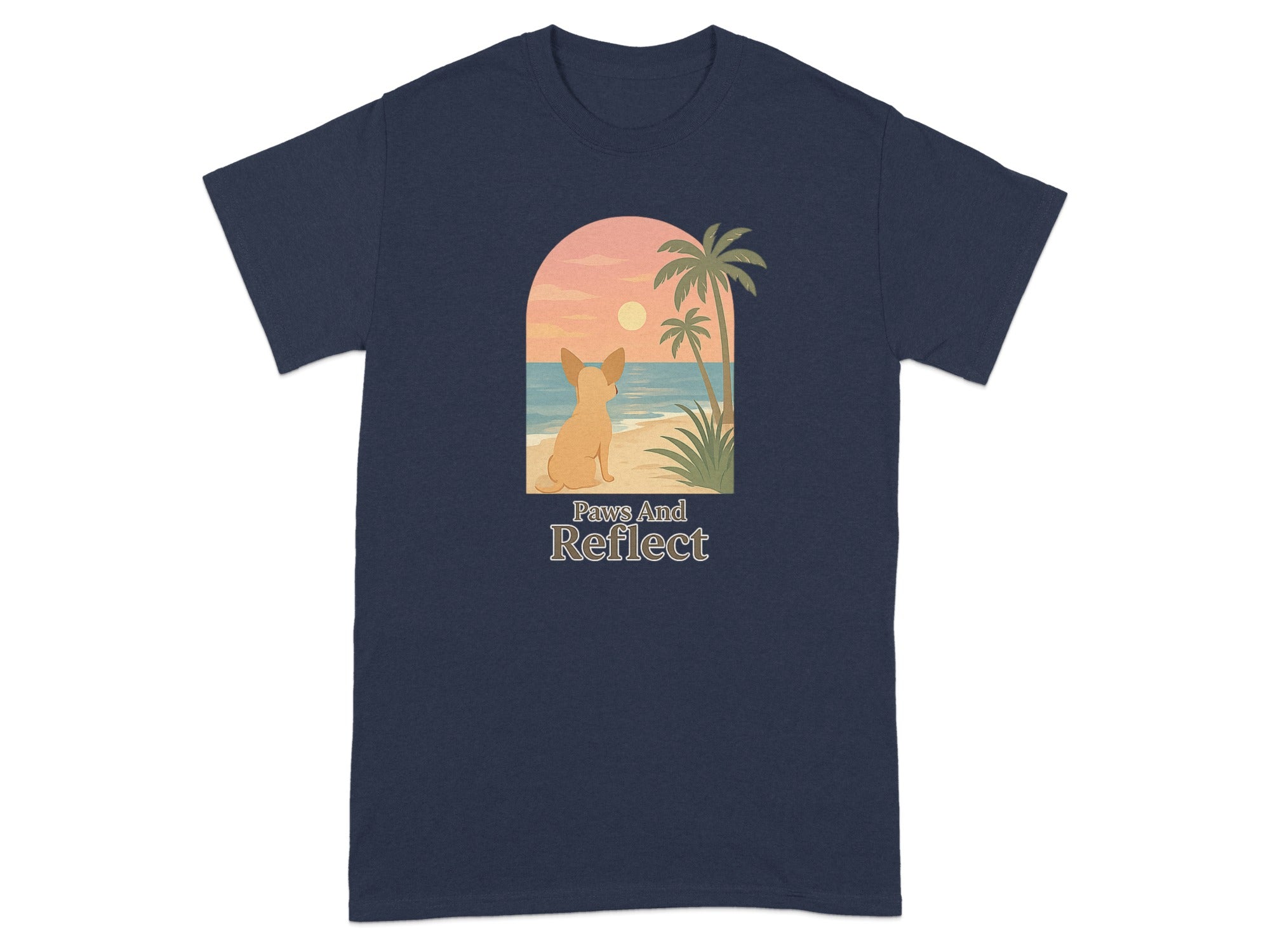 T-shirt with a dog looking at a beach sunset and palm trees, text says "Paws And Reflect".