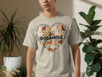 Heart shape filled with dog silhouettes and "DOGAHOLIC" text on a t-shirt.