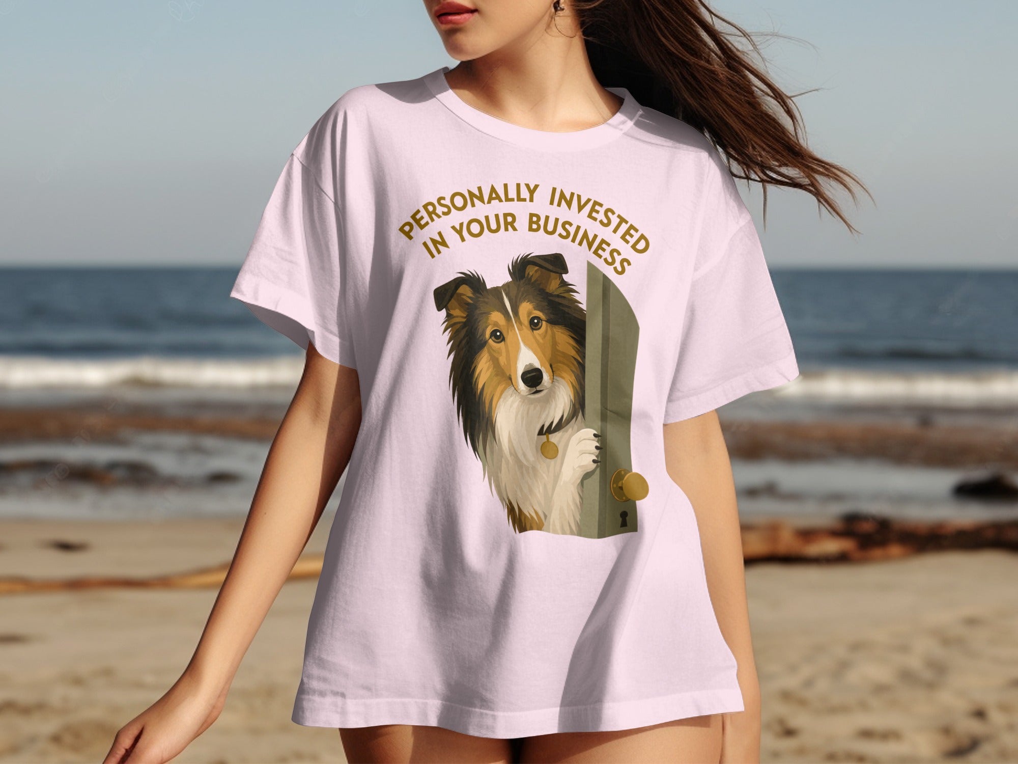 Pink t-shirt with a dog peeking through a door, text reads "Personally Invested In Your Business".