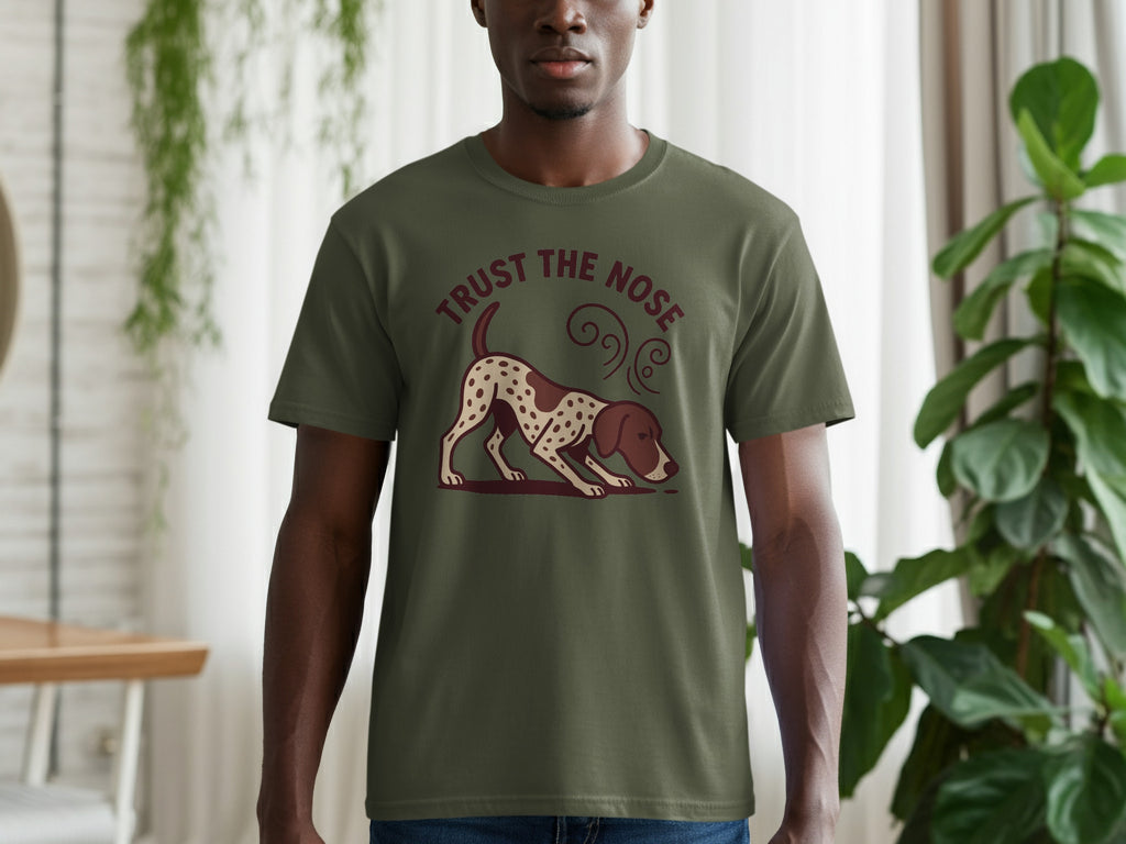 Green t-shirt with a hunting dog design and "TRUST THE NOSE" text.