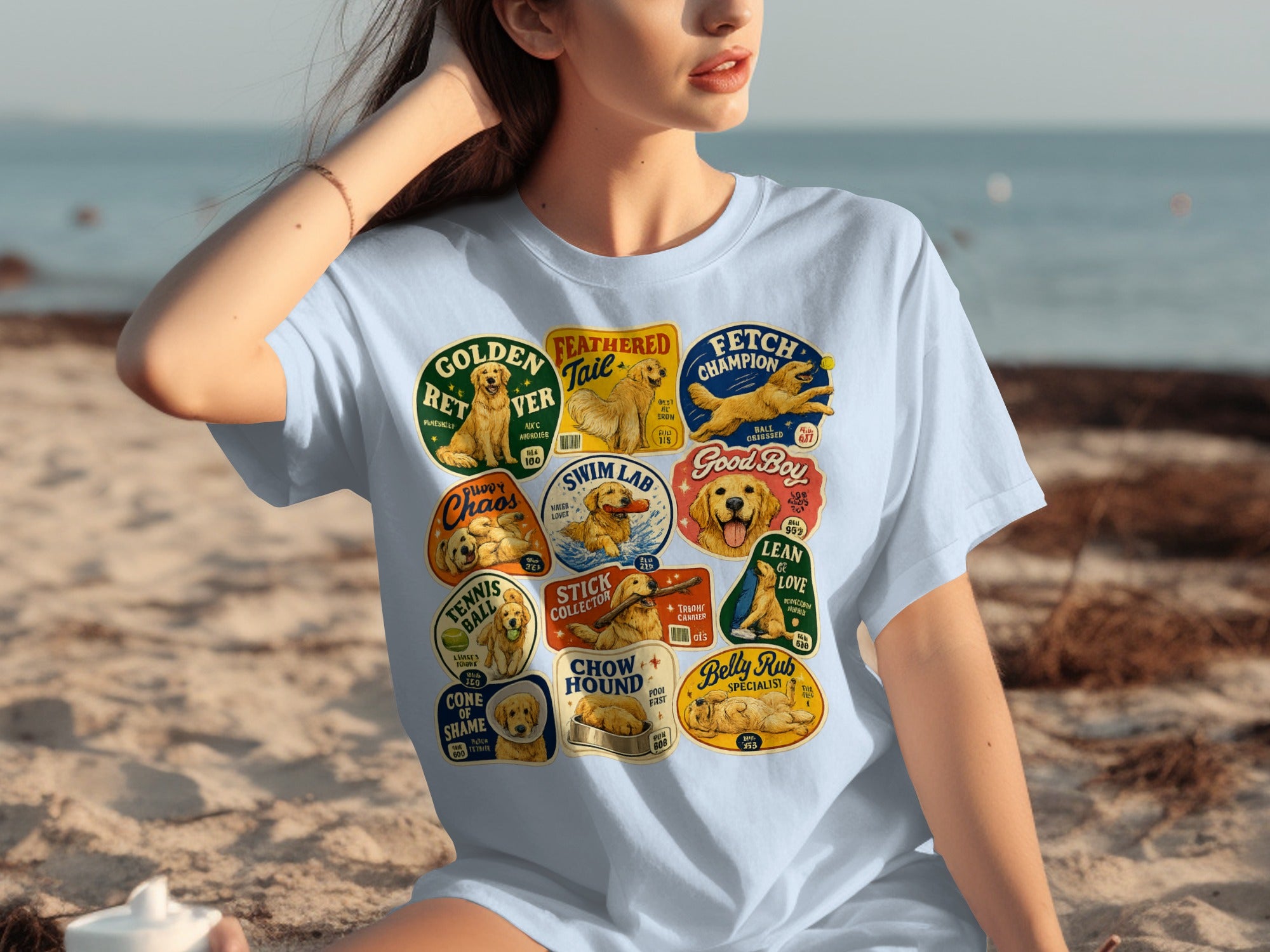 T-shirt with colorful cartoon dog breed emblems and text labels.