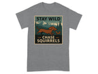Brown dachshund chasing a squirrel with mountains and trees behind, text says "STAY WILD CHASE SQUIRRELS".