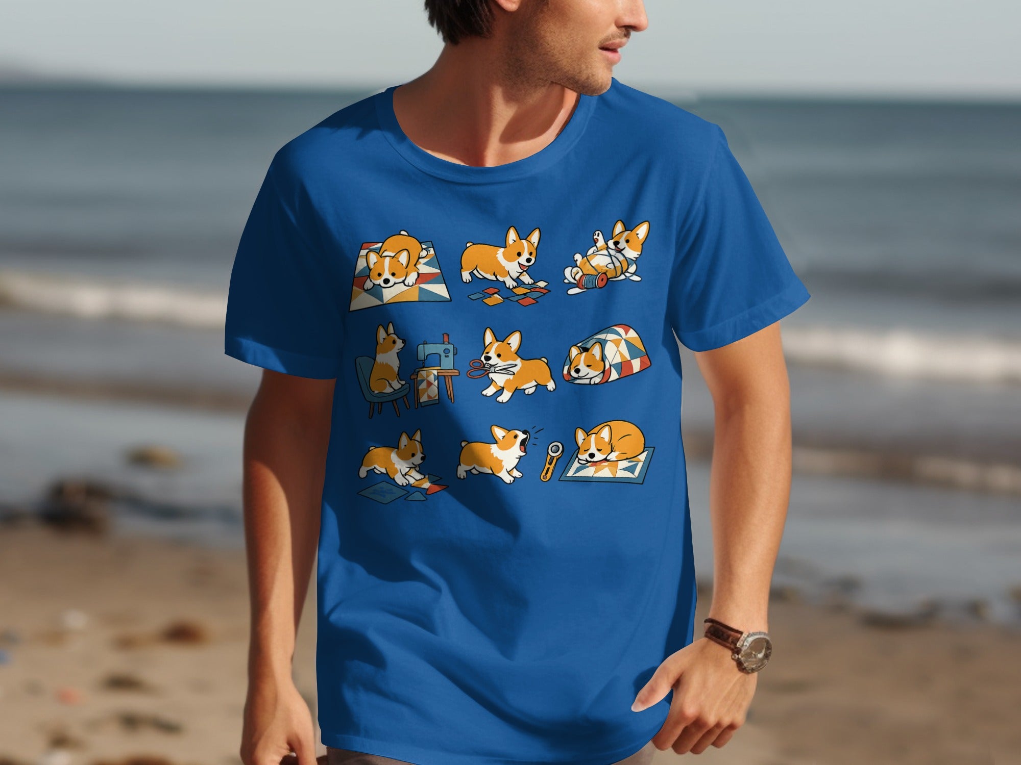 Blue t-shirt with nine cartoon corgis in various sewing and relaxing activities.