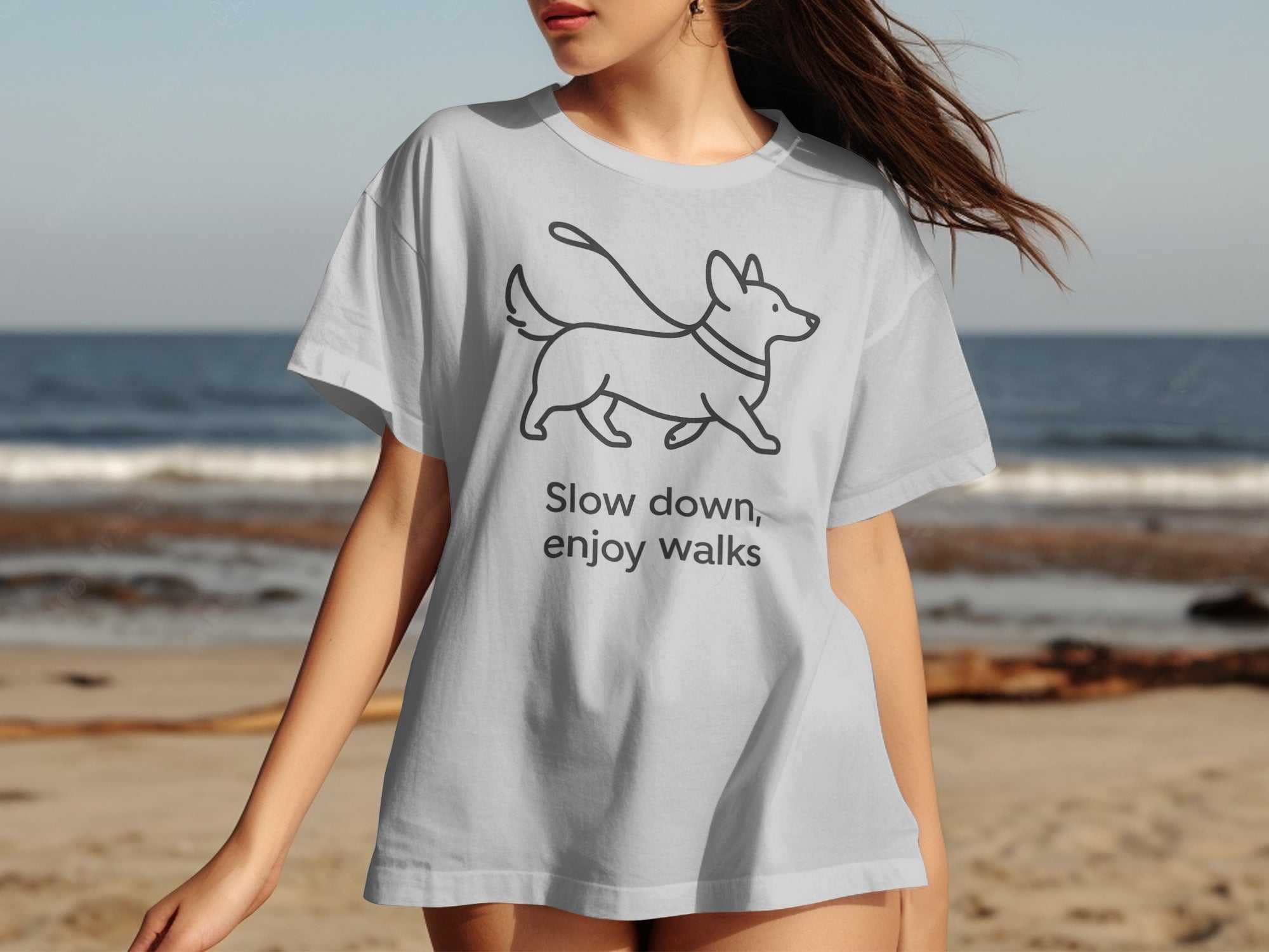 White t-shirt with line drawing of dog and text "Slow down, enjoy walks".
