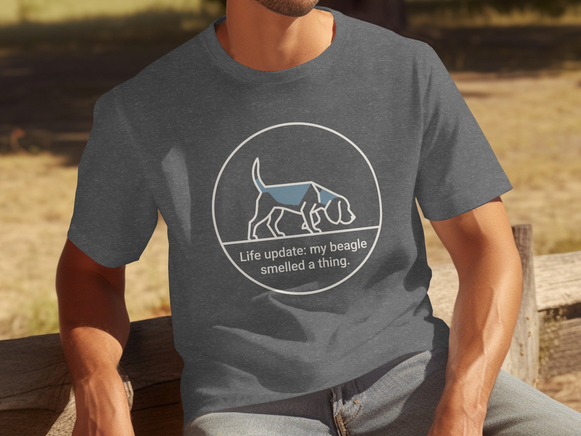 Dark gray t-shirt with a beagle illustration and text "Life update: my beagle smelled a thing."
