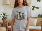 T-shirt with cartoon dogs sitting in a row, one with a bone.