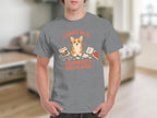 Grey t-shirt with "Chaos in a Compact Package" and corgi illustration.