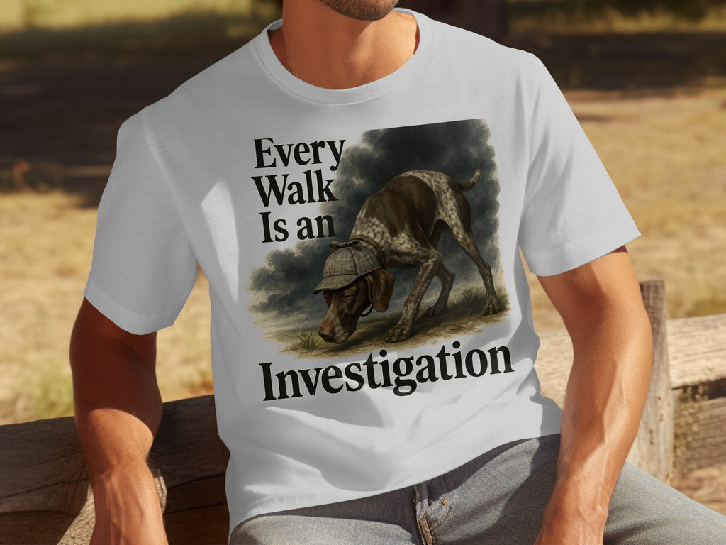 White shirt with a dog wearing a detective hat and text "Every Walk Is an Investigation".