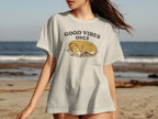 T-shirt with a graphic of a sleeping dog and text "GOOD VIBES ONLY".