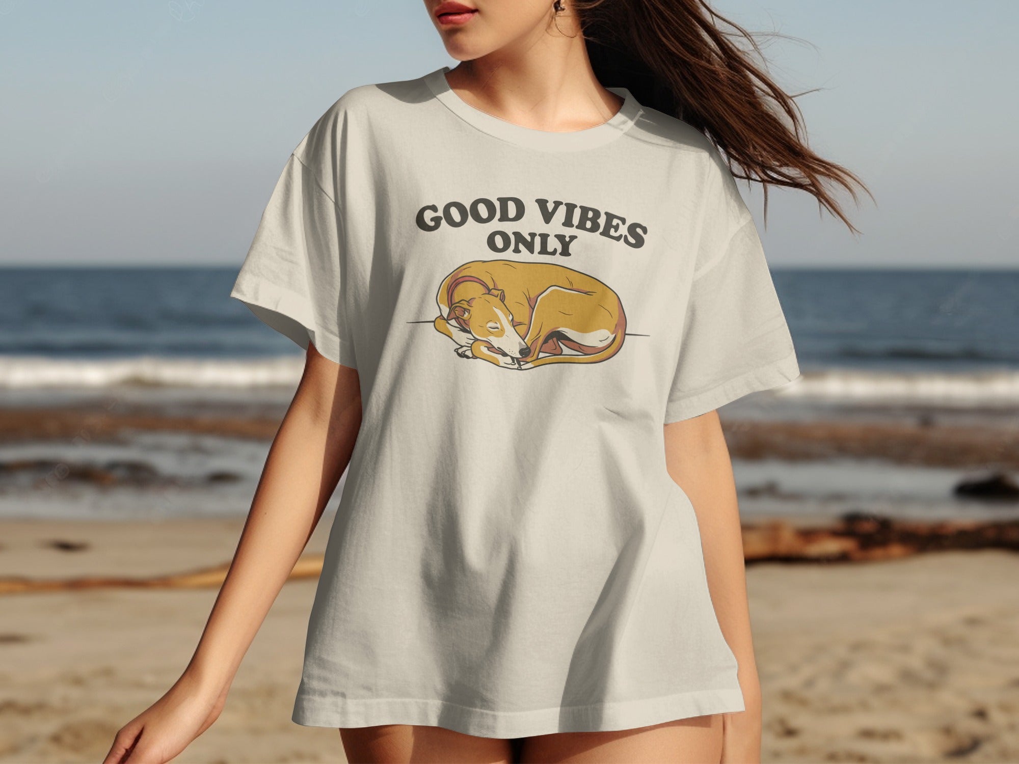 T-shirt with a graphic of a sleeping dog and text "GOOD VIBES ONLY".