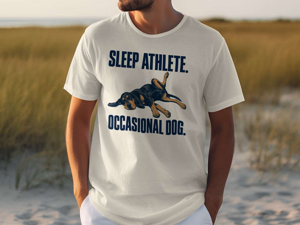 White t-shirt with "SLEEP ATHLETE. OCCASIONAL DOG." text and a dog graphic.