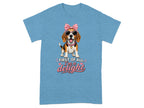 Blue t-shirt with a beagle wearing sunglasses and a pink bow, text reads "First of all, I'm a delight".