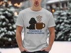 White t-shirt with a poodle and coffee cup graphic and "POWERED BY POODLE & COFFEE" text.