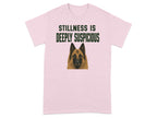 Pink t-shirt with a dog and text "STILLNESS IS DEEPLY SUSPICIOUS".