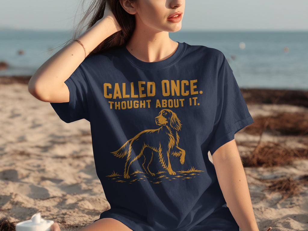 Navy t-shirt with "CALLED ONCE. THOUGHT ABOUT IT." and a dog graphic.
