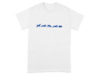 White t-shirt with blue graphic of dogs running towards a dog bed.