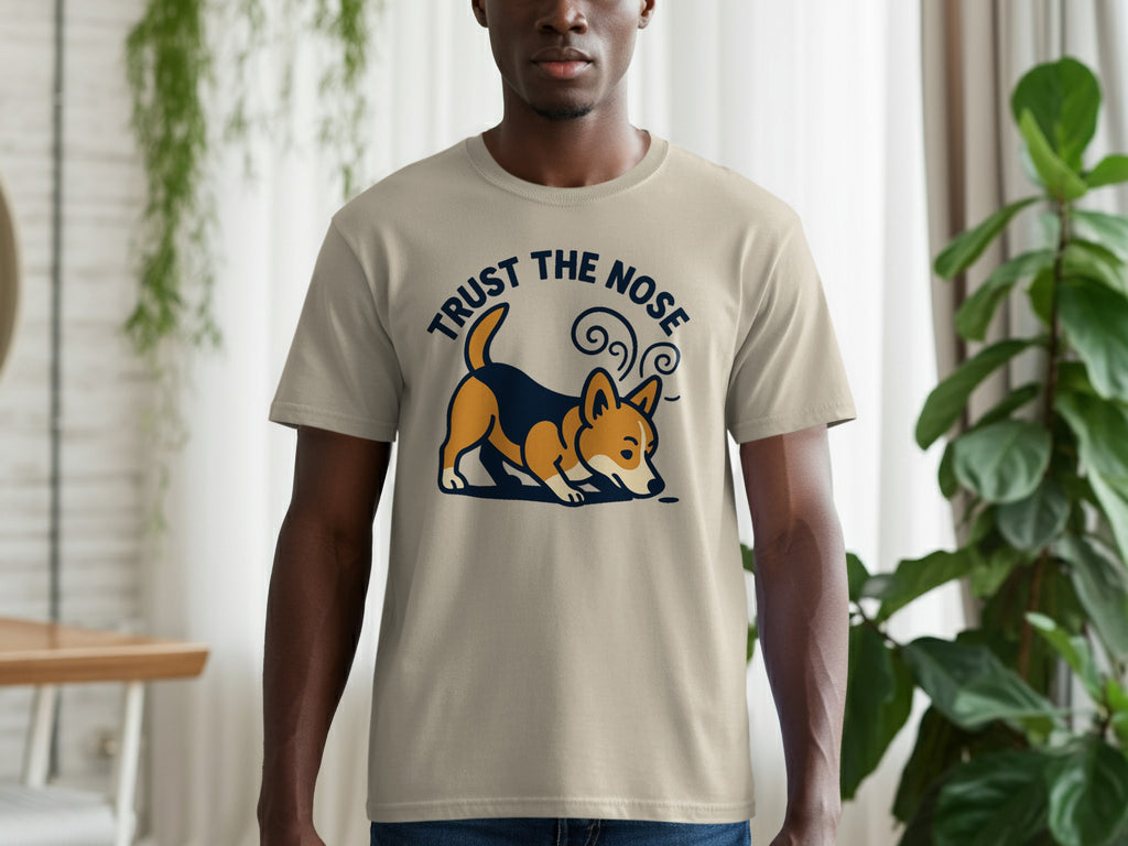 Beige t-shirt with a corgi graphic and text that says "TRUST THE NOSE".