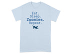 Light blue t-shirt with "Eat. Sleep. Zoomies. Repeat." and a dog silhouette.