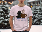 Black poodle with coffee cup graphic on light pink t-shirt.