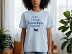 Light blue t-shirt with "Eat. Sleep. Zoomies. Repeat." and a dog graphic.
