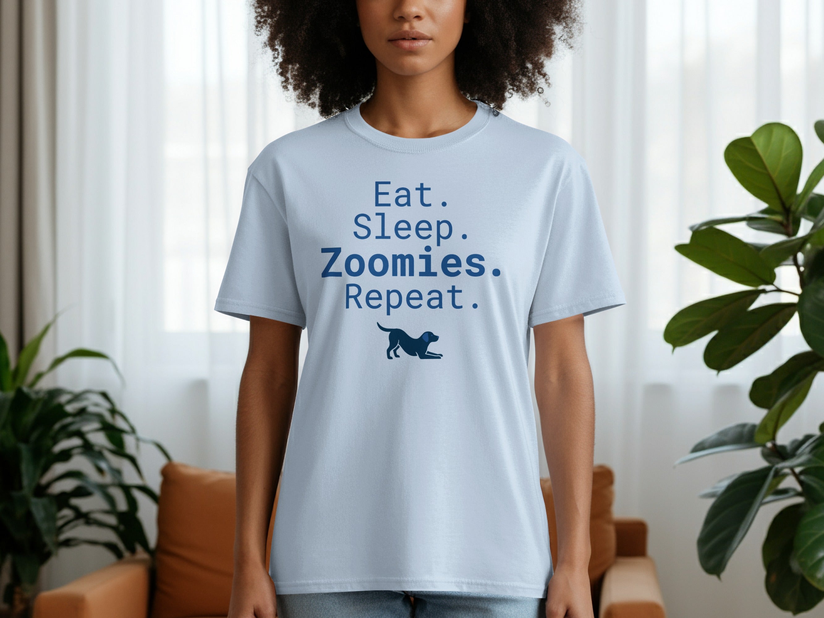 Light blue t-shirt with "Eat. Sleep. Zoomies. Repeat." and a dog graphic.