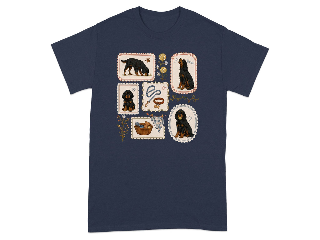 Dark blue t-shirt with small illustrations of black puppies and dog accessories.