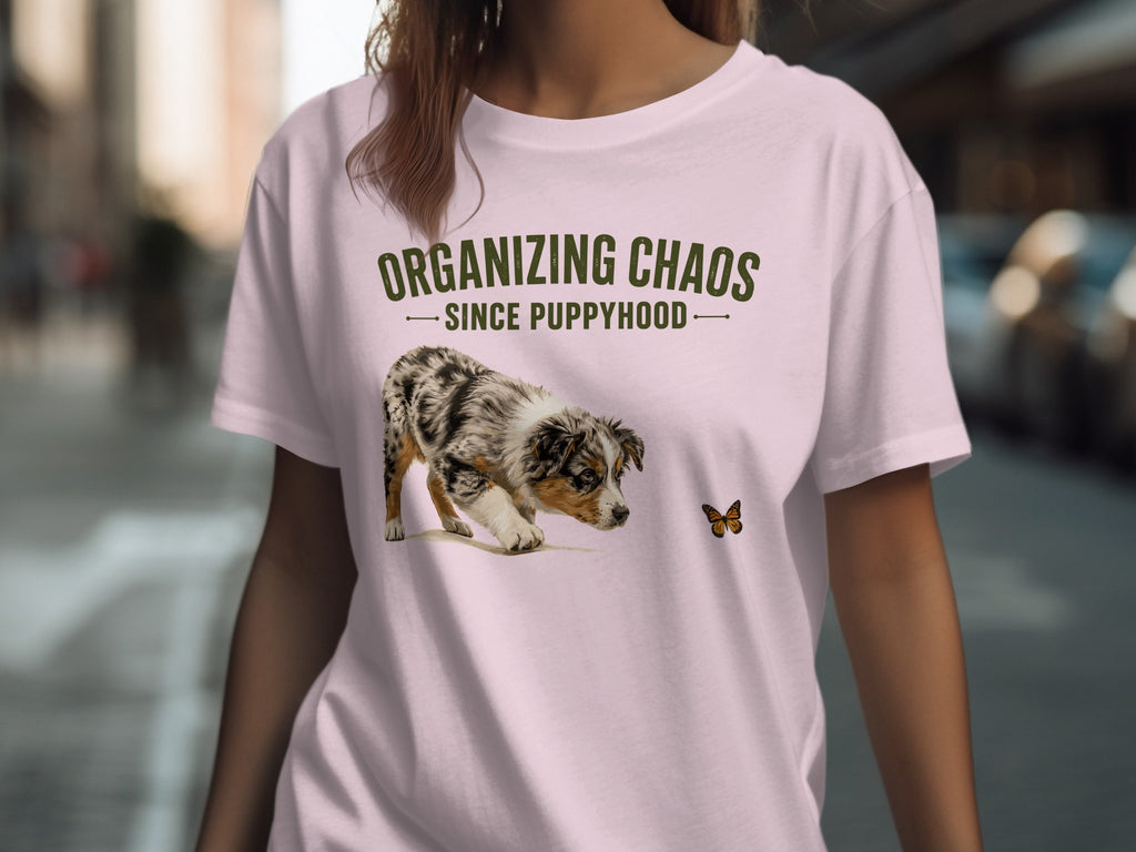 Pink t-shirt with "Organizing Chaos Since Puppyhood" text and a puppy chasing a butterfly.