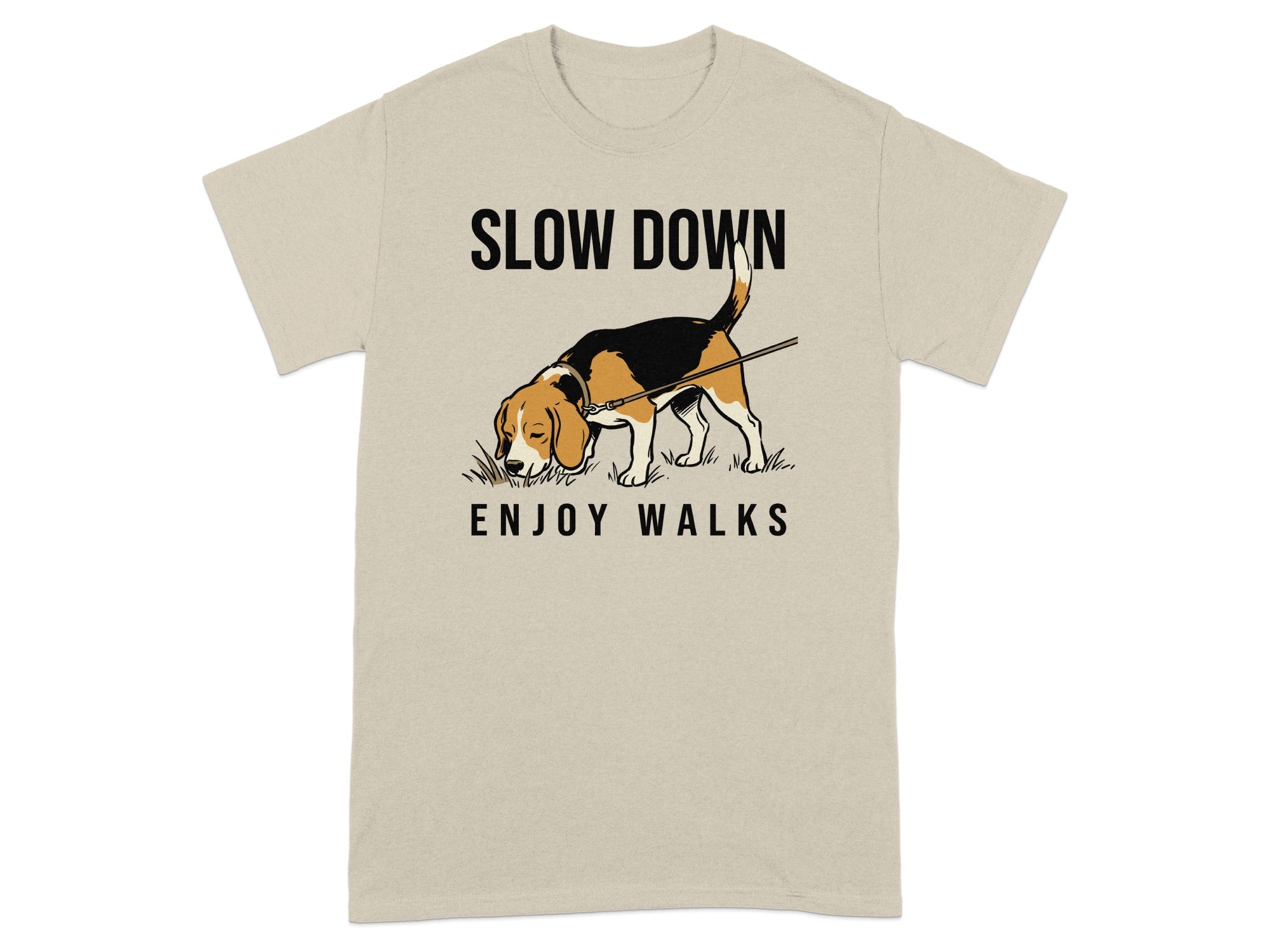 Beagle dog with "SLOW DOWN ENJOY WALKS" text on tan t-shirt.