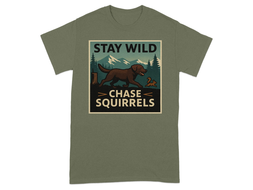 T-shirt graphic with a brown dog chasing a squirrel in a forest scene, text reads "STAY WILD CHASE SQUIRRELS".