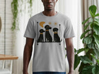 Grey t-shirt with graphic of three black dogs on a shelf, one with glasses.