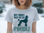 White t-shirt with dark blue "Why Doodle When You Can Poodle" text and poodle graphic.