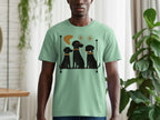 T-shirt with illustration of three black dogs in a row.