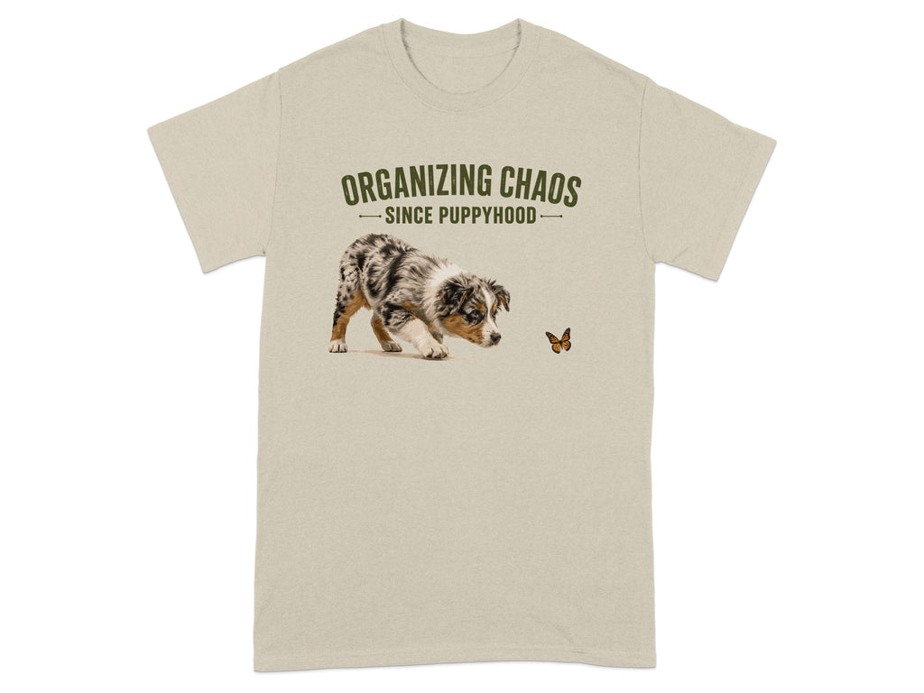 Light beige t-shirt with "Organizing Chaos Since Puppyhood" and a dog chasing a butterfly.