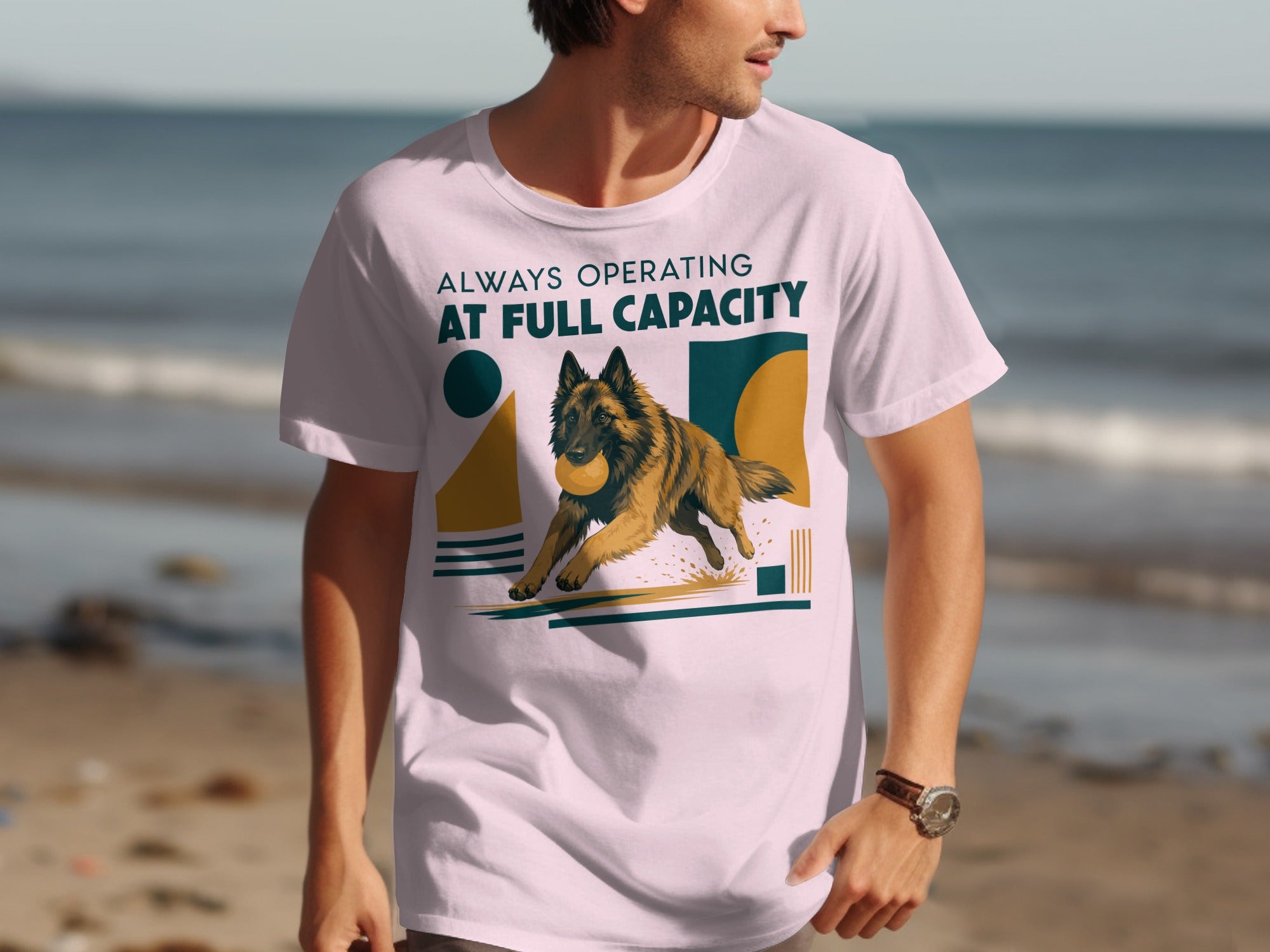 Man wearing a white t-shirt with a dog catching a ball graphic.