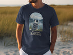 Navy t-shirt with a scenic mountain, lake, and dog graphic and text "Paws And Reflect."
