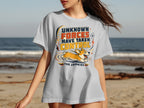 White t-shirt with cartoon corgi and text "UNKNOWN FORCES HAVE TAKEN CONTROL THE ZOOMIES".