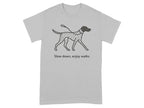 Grey t-shirt with a black line drawing of a Dalmatian dog and leash, reading "Slow down, enjoy walks".