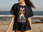 Black t-shirt with a beagle wearing sunglasses and a pink bow, "First of all, I'm a delight" text.