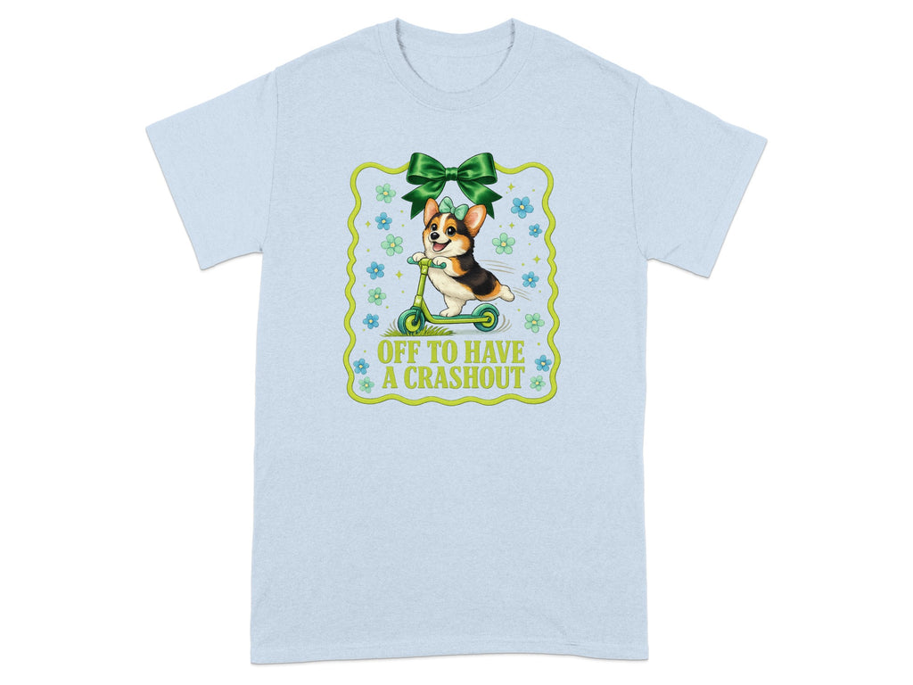 Corgi wearing bow riding scooter with text "OFF TO HAVE A CRASHOUT".