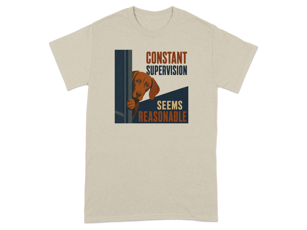 Beige t-shirt with dog peeking from corner and text "Constant Supervision Seems Reasonable".